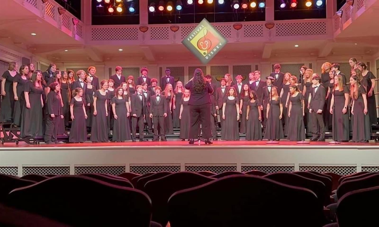 Students sing onstage